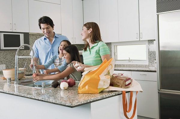 Family Preparing Food in Kitchen